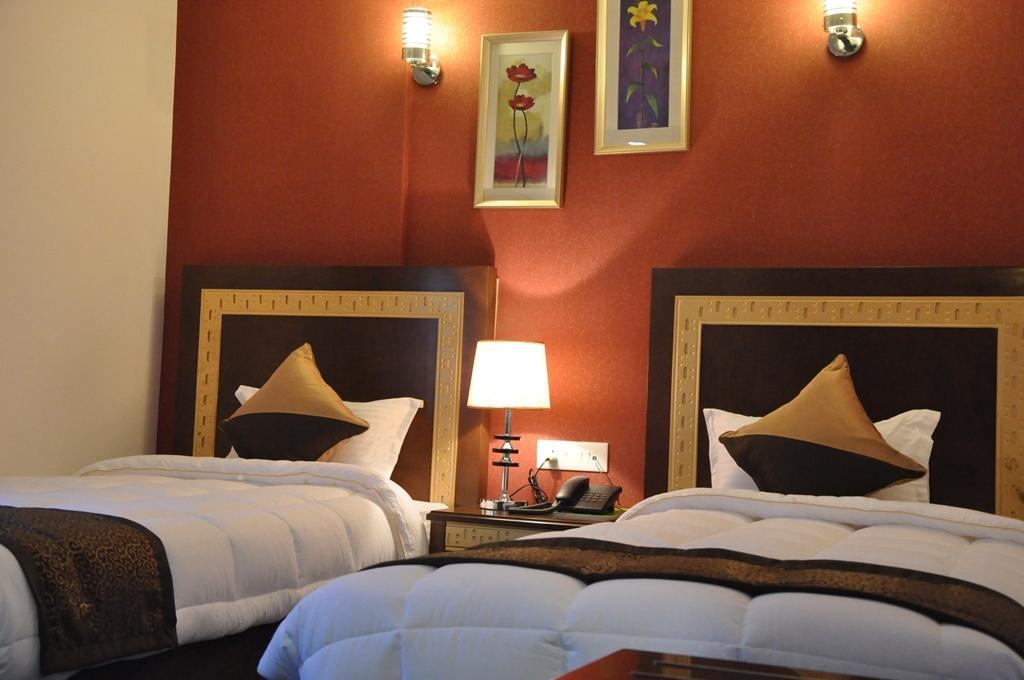 Silk Route Hotell Guwahati Rum bild